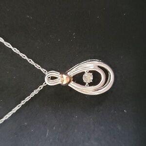 Sterling silver/10k rose gold necklace with diamond rhythm pendant